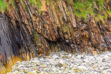 Rocky beach with natural pattern on the wet rock
