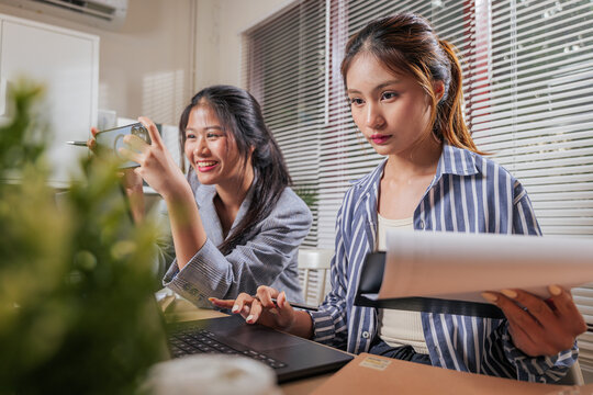 Young business women team work online, people learning and collaborating at home office, sharing ideas, focusing on project success with laptop, mobile device for team meeting - Powered by Adobe