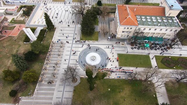 High-altitude drone video of Pleven&rsquo;s center during Bulgaria&rsquo;s Third of March National Day, showing a large crowd carrying an extremely long national flag, Pleven, BG, 03 March 2019