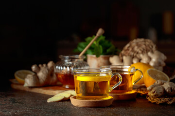 Ginger tea with lemon, honey, mint, and ginger root.