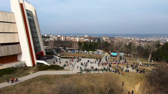 Aerial footage of the Pleven Panorama on Third of March 2019. Visitors gather in Skobelev Park, paying tribute and carrying a 740-meter Bulgarian flag, BG, EU, 03 March 2019