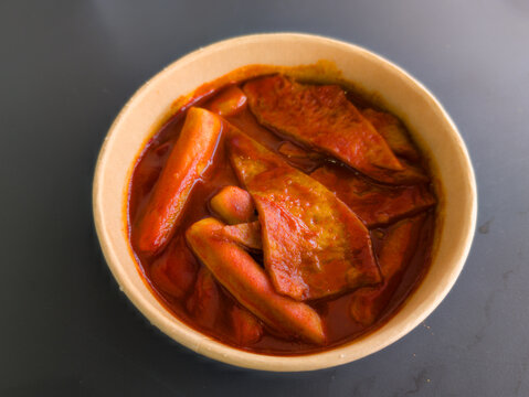 Delicious Toppoki with Spicy Red Sauce in Classic White Bowl