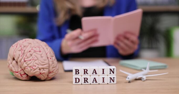 Exploring the concept of brain drain with creative journaling and reflection in a cozy workspace setting