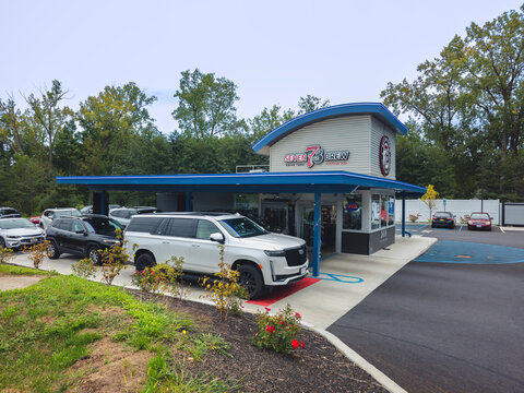 New Hartford, NY - Aug 30, 2024: Wide view of 7 Brew Coffee, it is a fast-growing drive-thru coffee chain founded in 2017 with over 553 locations nationwide, known for its custom drinks, rapid service