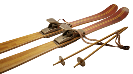 Stunning antique wooden skis and poles with vintage leather straps displayed against a dramatic black background isolated on white background
