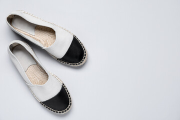 Pair of stylish espadrille shoes on white background, flat lay. Space for text