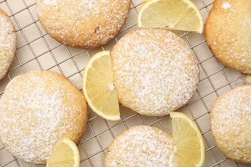 Tasty lemon cookies with fruit slices on white table, top view