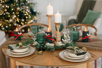 Festive table setting with Christmas decor indoors, closeup