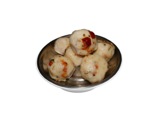 Upma kozhukattai. steamed rice dumpling. uppu urundai with dried red chilies. upma. kozhukattai. dumpling. This is a plate of Uppu Urundai, also known as Upma Kozhukattai, a South Indian dish.