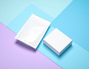White pack & box on angled pastel-colored geometric surface