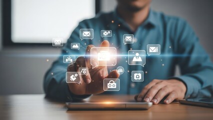 Person touching glowing digital icons, interface on a smartphone or tablet