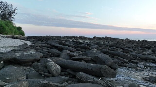 Ocean horizon with rocky foreground and sunset sky at Saint Martin, Teknaf, Cox&rsquo;s Bazar, Bangladesh - 4k smooth video shot