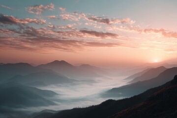 Obraz premium beautiful sunset over misty mountains, background with copy space