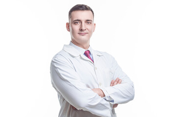 Medical Concepts. One Caucasian Professional Confident Male GP Doctor Posing in Doctor Smock with Hands Folded on White.
