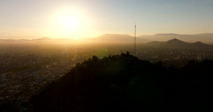 Incredible silhouetted cityscape Santiago City and San Cristobal hill in Chile