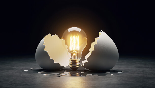 Light bulb inside broken egg with cracked shell on dark surface in creative concept