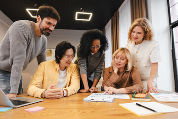 Fototapeta premium Diverse business team collaborating during meeting, discussing project strategy