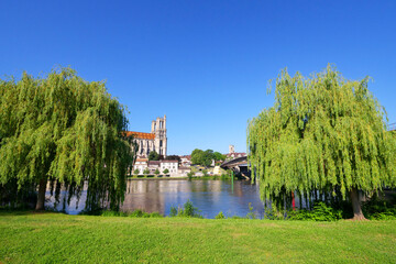 Seine river bank and collegiate church of  Mante-la-Jolie  city. Ile-de-France region