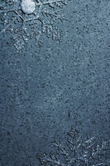 Sparkling Clear Acrylic Snowflake Christmas Ornament on Textured Gray Background