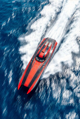 Top view of a racing boat at full speed