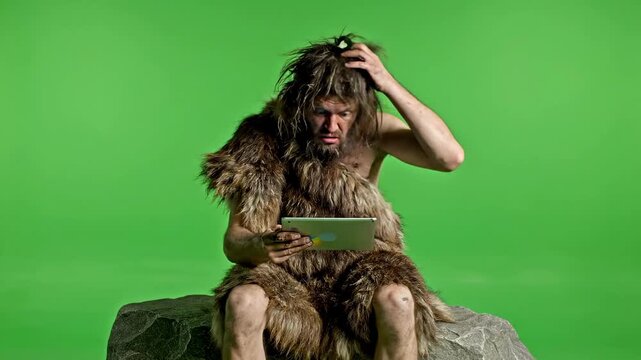 Primitive Man Confused by Tablet Technology Green Screen