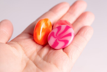 Real swirl lollipop assortment in hand for vibrant food marketing visuals.