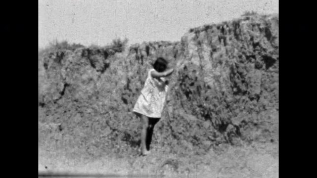Beautiful, sexy woman in flowing dress in summer countryside. Black and white archive film. Light femininity. Uninhibited youth. Young barefoot beautiful female. Old retro 1960s. Vintage archive. Beautiful, sexy woman in flowing dress in summer countryside. Black and white archive film. Light femininity. Uninhibited youth. Young barefoot beautiful female. Old retro 1960s. Vintage archive.