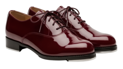 Isolated classic pair of shiny patent leather tap shoes, theater arts fashion accessory