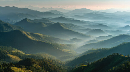 Obraz premium misty mountain range at sunrise with layers of peaks and valleys