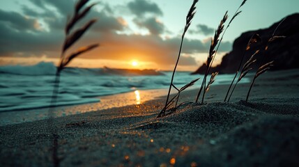 A serene beach scene at dusk, with golden light reflecting on wet sand, waves, and wispy grasses. A rocky cliff is in the background
