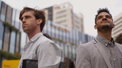 Diverse group of inspired business people looking up at the sky