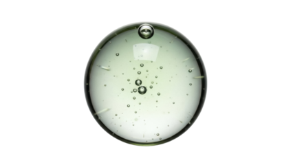 Isolated close-up of green glass sphere with bubbles floating inside, a mesmerizing object