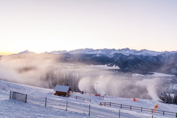 Sunrise Over Winter Ski Resort. Snow Mountains Slope Landscape. Winter Sport Activities Travel Tourism Background