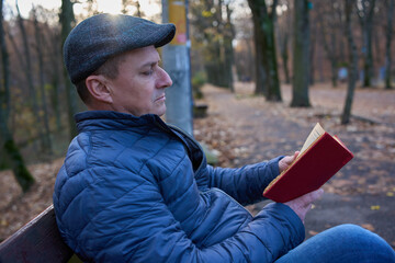 Man enjoying book reading in park