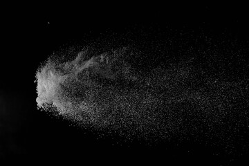The falling white snow on a black background