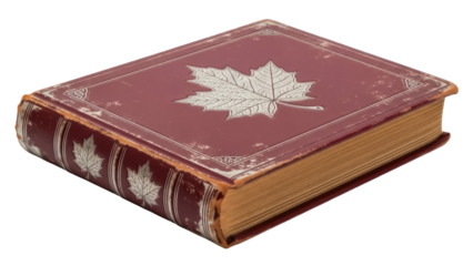 Isolated ornate old book with a maroon cover featuring a silver leaf design, antiquity