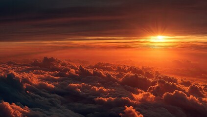 Fototapeta premium Majestic aerial view of a sunrise piercing through layers of fluffy clouds with vibrant orange hues