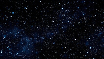 A vast expanse of deep, star-studded night sky, with scattered luminous points against a black background