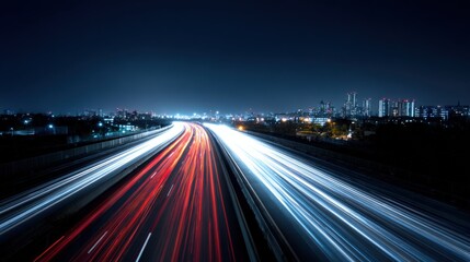 Obraz premium Nighttime Highway with Light Streaks and Cityscape in the Distance, representing movement, and urban life