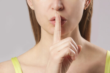 Fototapeta premium Finger on lips - silent gesture 