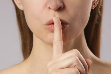 Finger on lips - silent gesture	