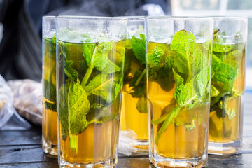 glasses of mint tea with fresh leaves, Ibn Khaldoun Square, Asilah, Morocco, North Africa