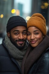 Smiling couple wearing winter hats and scarves in urban cityscape