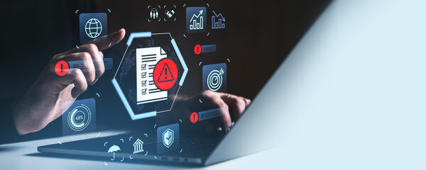 Cybersecurity risk management concept with digital warning icons and checklist on futuristic interface over laptop on gradient background..