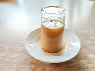 Traditional Javanese Coffee Milk Drink with Saucer