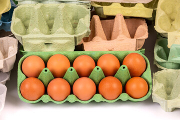 10 fresh chicken eggs  with egg boxes close up