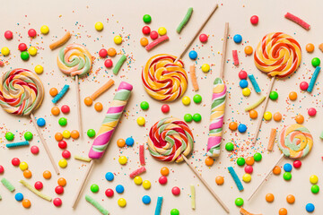 Tasty appetizing Party Accessories Happy Birthday Sweet. Different types of candies on colored...