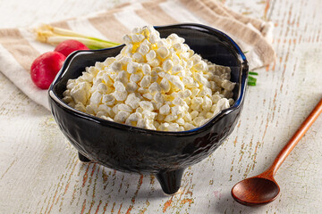 Grain cottage cheese in the bowl