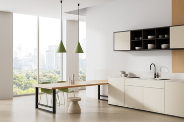 Modern minimalist kitchen interior with light beige cabinets, green pendant lights, and city view through large windows in elegant daylight setting. 3D Rendering