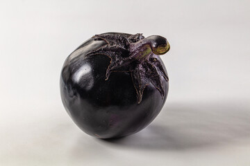 Raw round black big eggplant